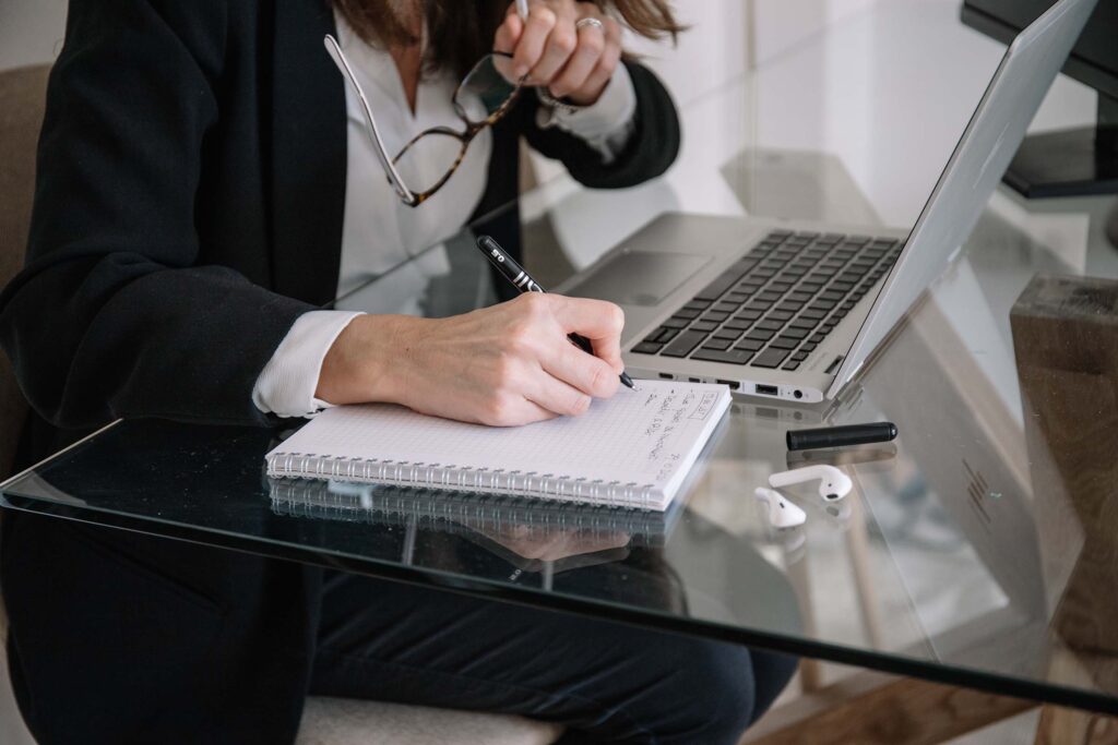 woman-making-notes-during-telework-at-home-JJA9B72.jpg